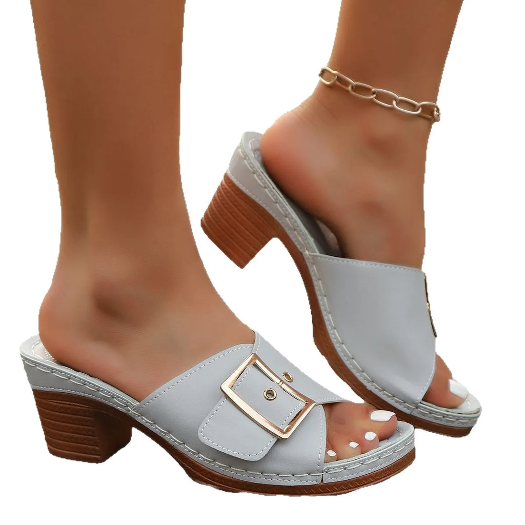 Women's black summer slippers with chunky heel and silver metal buckle on round toe design