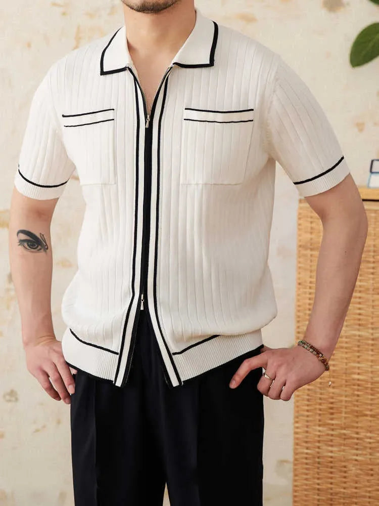 Slim-fitting black short-sleeved polo shirt with a lapel collar, made from a knitted viscose and polyester fabric blend.