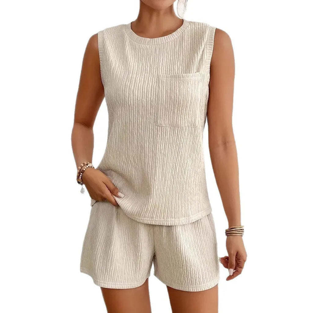 Women's apricot sleeveless round neck vest and matching shorts set on a hanger.