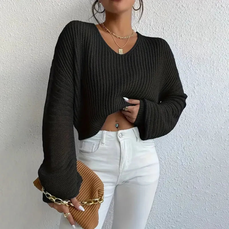 Women's solid colour long sleeve polyester pullover jumper in a loose casual fit.