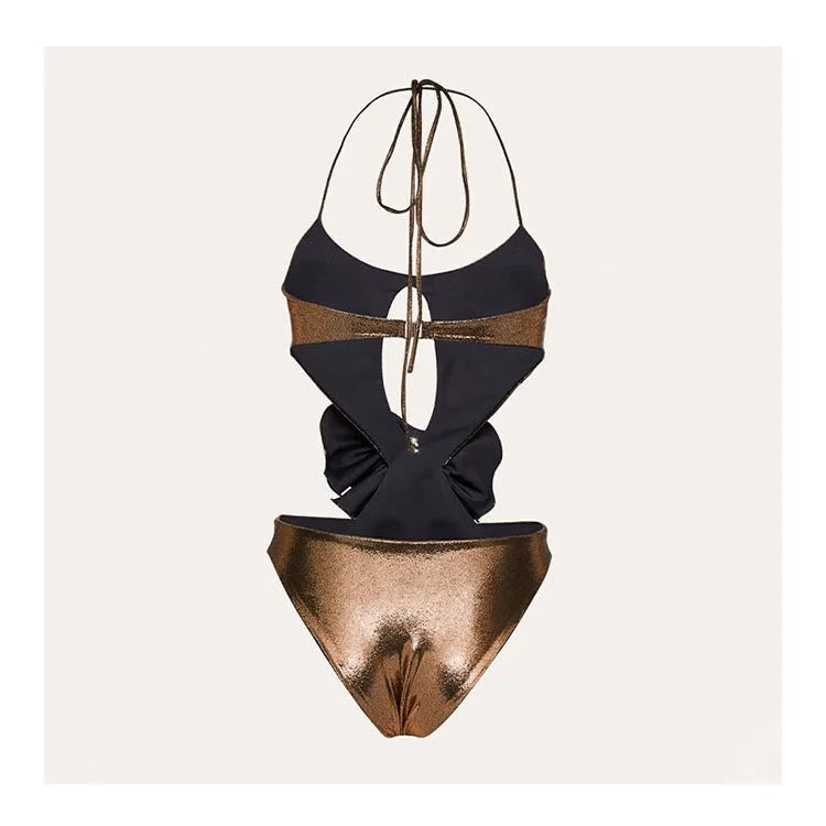 Gold coloured handmade halter neck one-piece swimsuit with hollow-out design on a mannequin.
