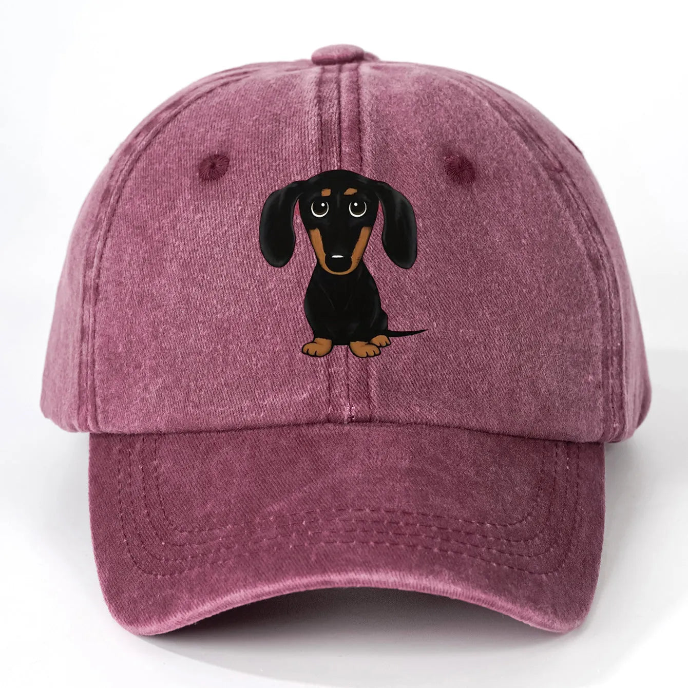 Retro washed blue cotton baseball cap with a machine-embroidered brown Dachshund dog graphic on the front.