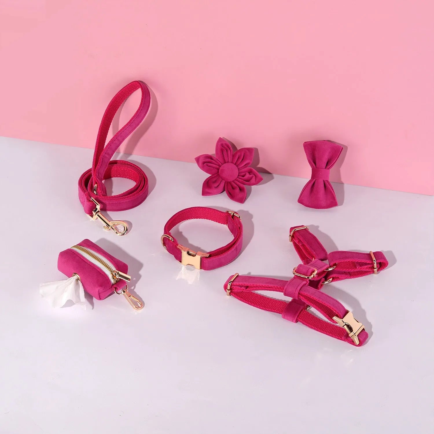 Complete velvet dog collar and traction rope set with bow tie, flower, and toilet bag on a table
