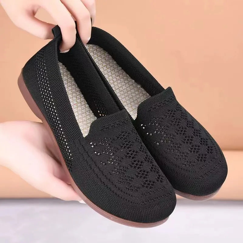 Beige low-top mesh casual trainers for women with a round toe and flat PVC sole.
