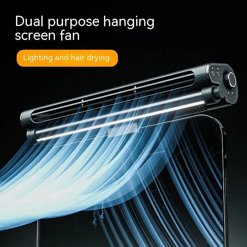 Black USB-powered bladeless clip-on fan with integrated lamp attached to a laptop screen.