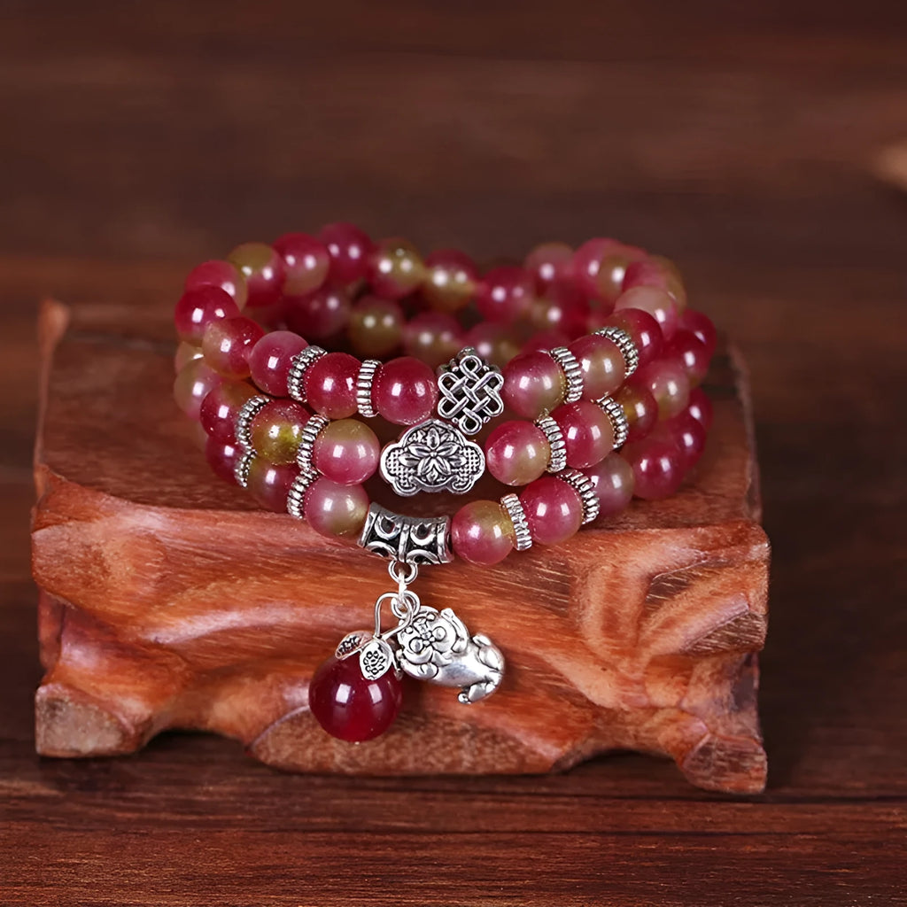Handmade watermelon crystal bracelet with traditional Chinese knot design in geometric beads