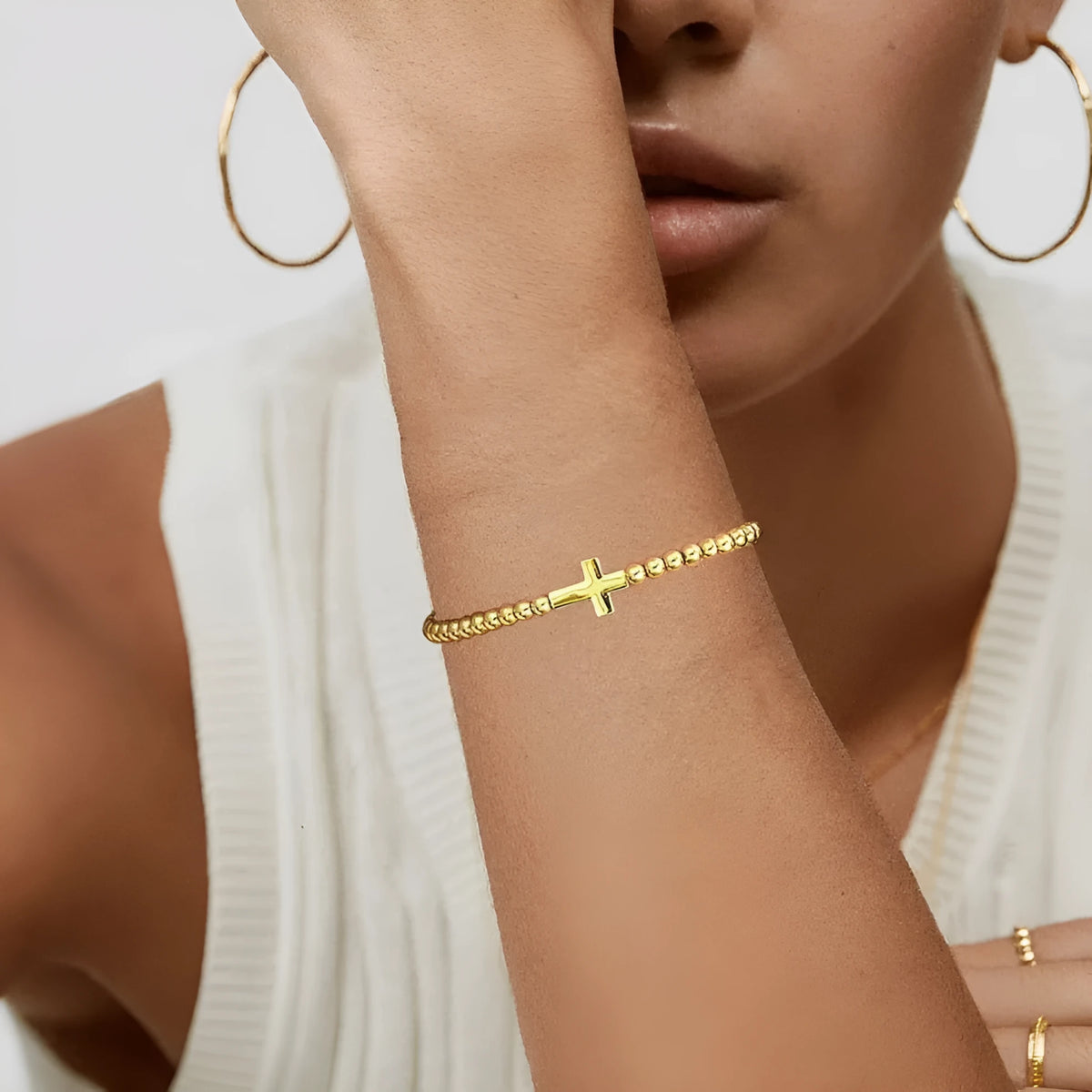 Adjustable stainless steel beaded bracelet for women in a simple geometric style with round beads.