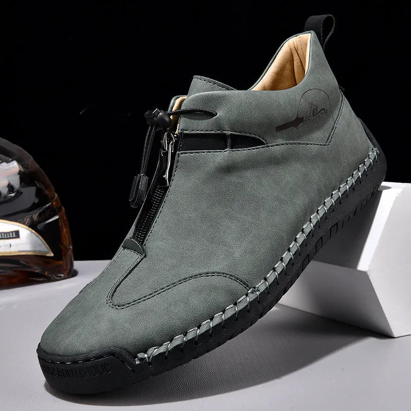 Men's black casual leather shoes with a round toe, rubber sole, and mid-height heel.