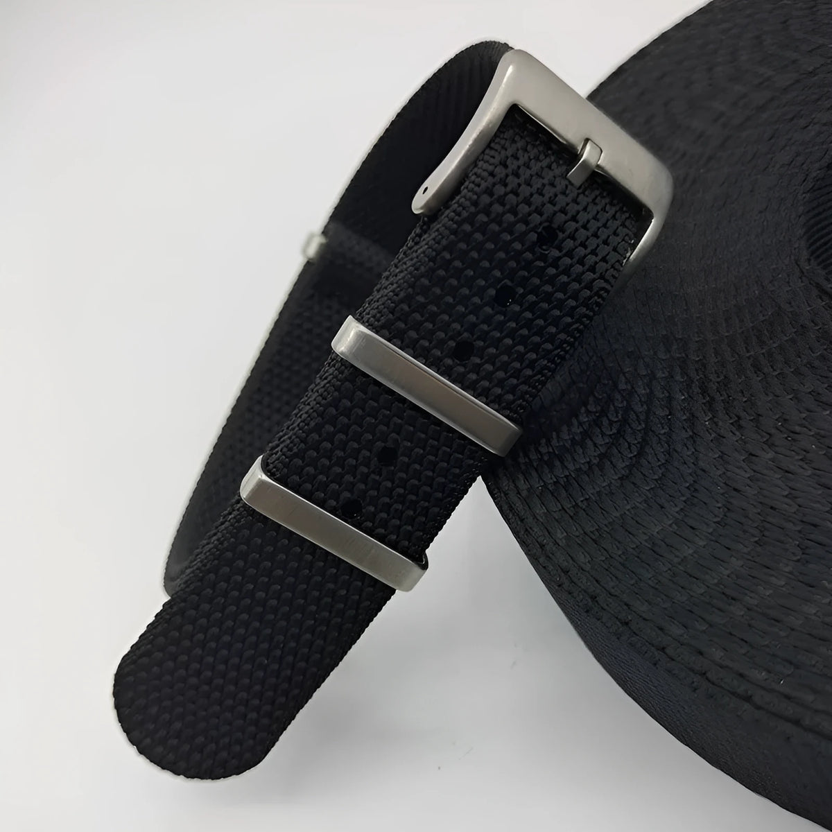 Woven nylon textile watch strap in army green colour showing integrated construction