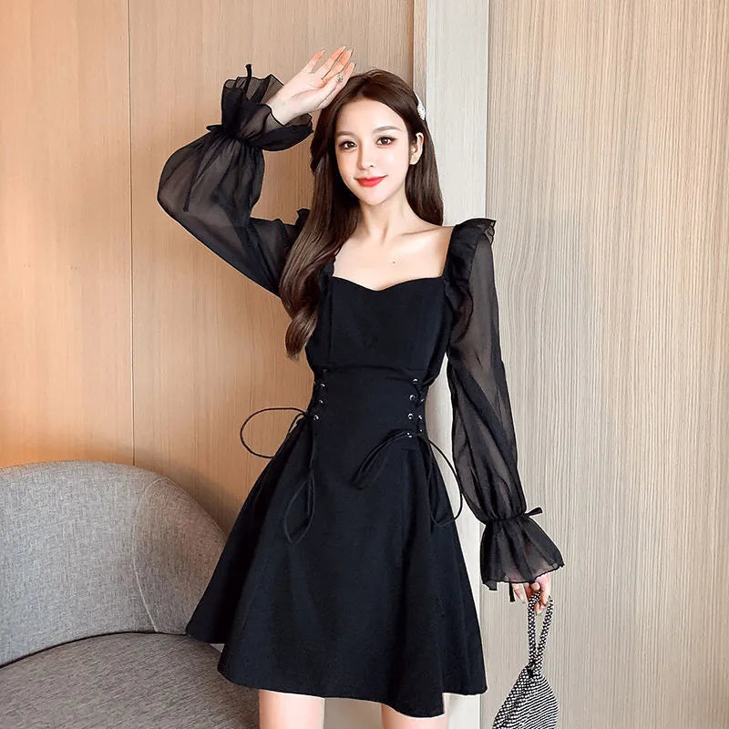 White waist-slimming chiffon patchwork dress with long sleeves on a woman