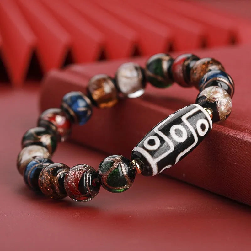 Handcrafted coloured glaze bracelet with Chinese auspicious patterns and snake beads in 10mm, 12mm, or 14mm sizes.