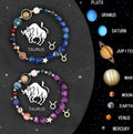 Two natural stone beaded bracelets laid out, part of a twelve-style zodiac set.
