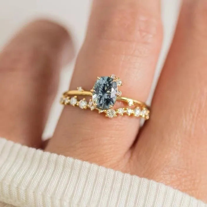 Gold electroplated women's ring with floral design and green zircon stone inlays on alloy base