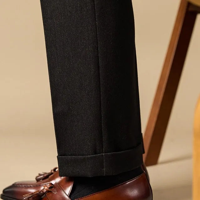 British-style leather tassel loafers in polished black leather with rubber sole