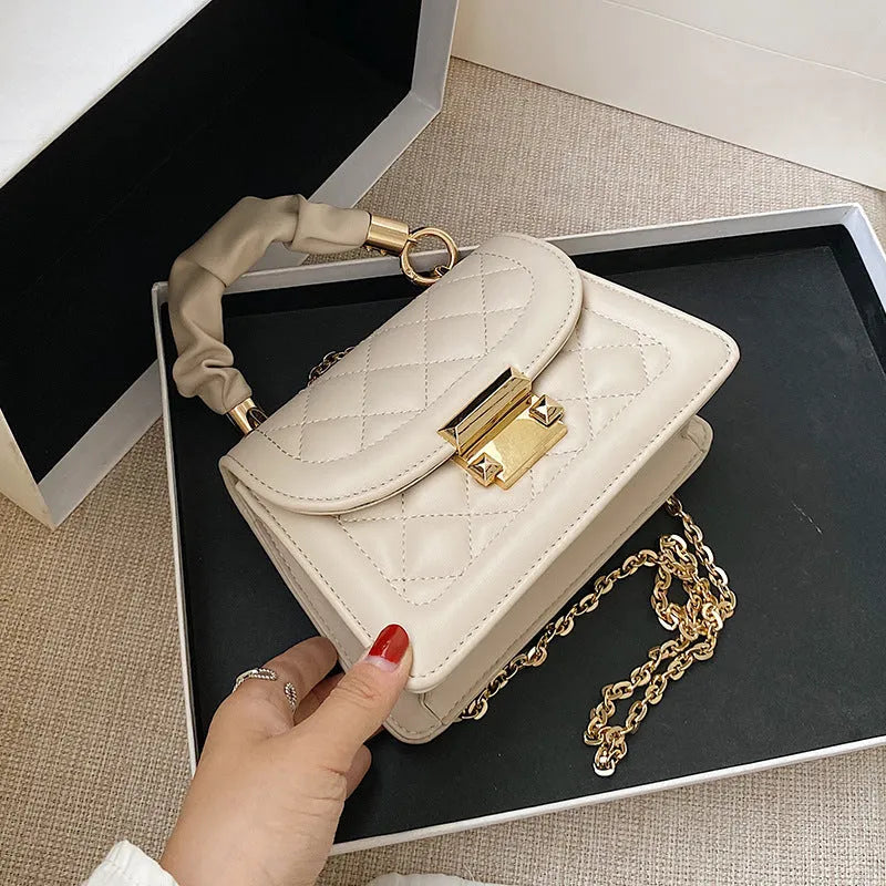 Women's purple PU fabric small square shoulder bag with 112cm strap showing rhombus shape and compact dimensions