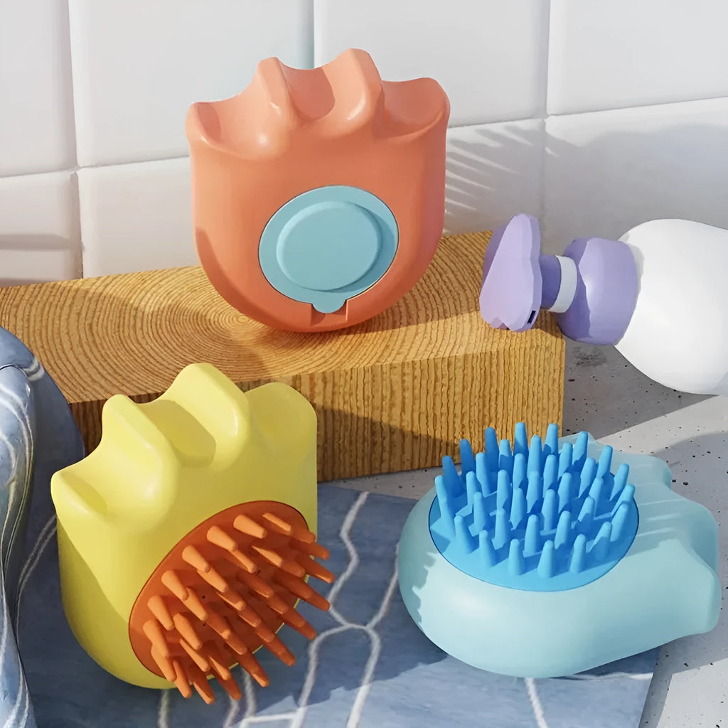 Blue pet bath brush with a built-in shampoo reservoir and massage comb bristles.