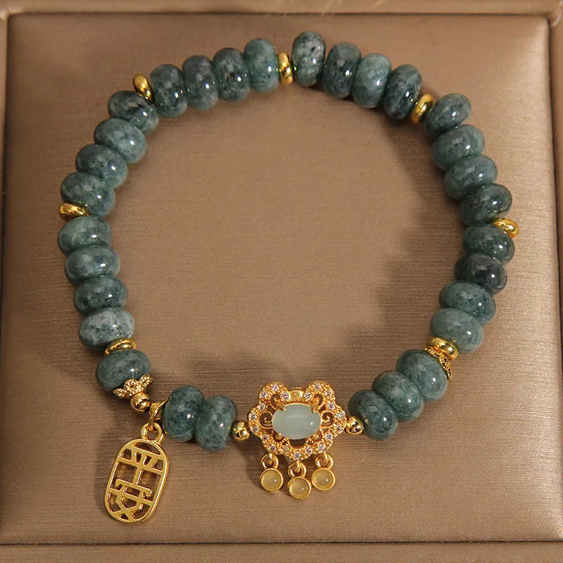 Natural emerald jade abacus bead bracelet for women with a metal safety lock closure.