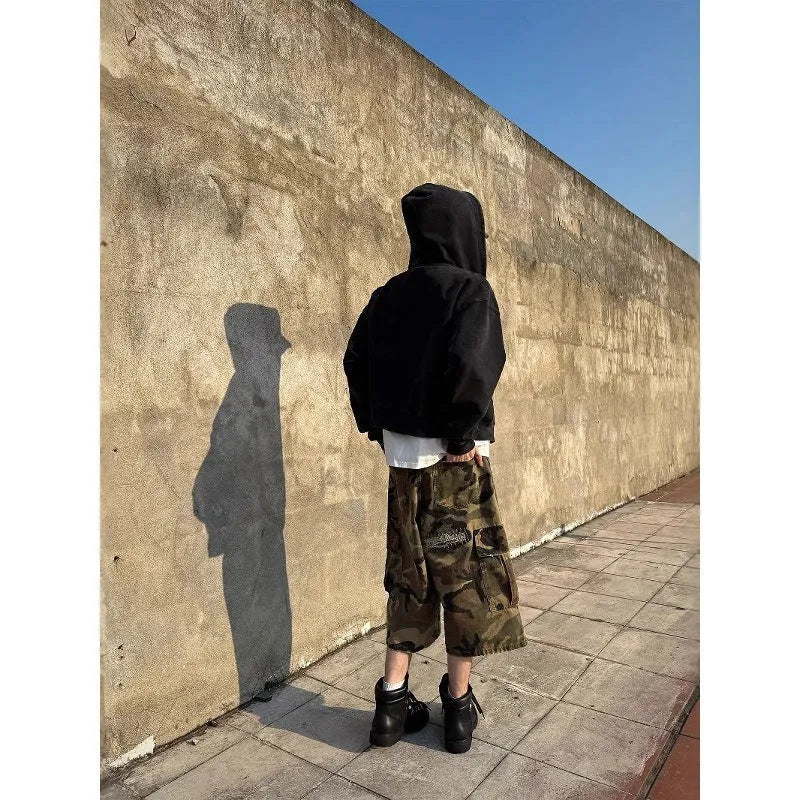 Men's camouflage cropped jeans with patchwork and ripped detailing in straight-leg loose fit