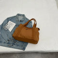 Large canvas shoulder bag for women in solid colour with external pocket and internal phone compartment