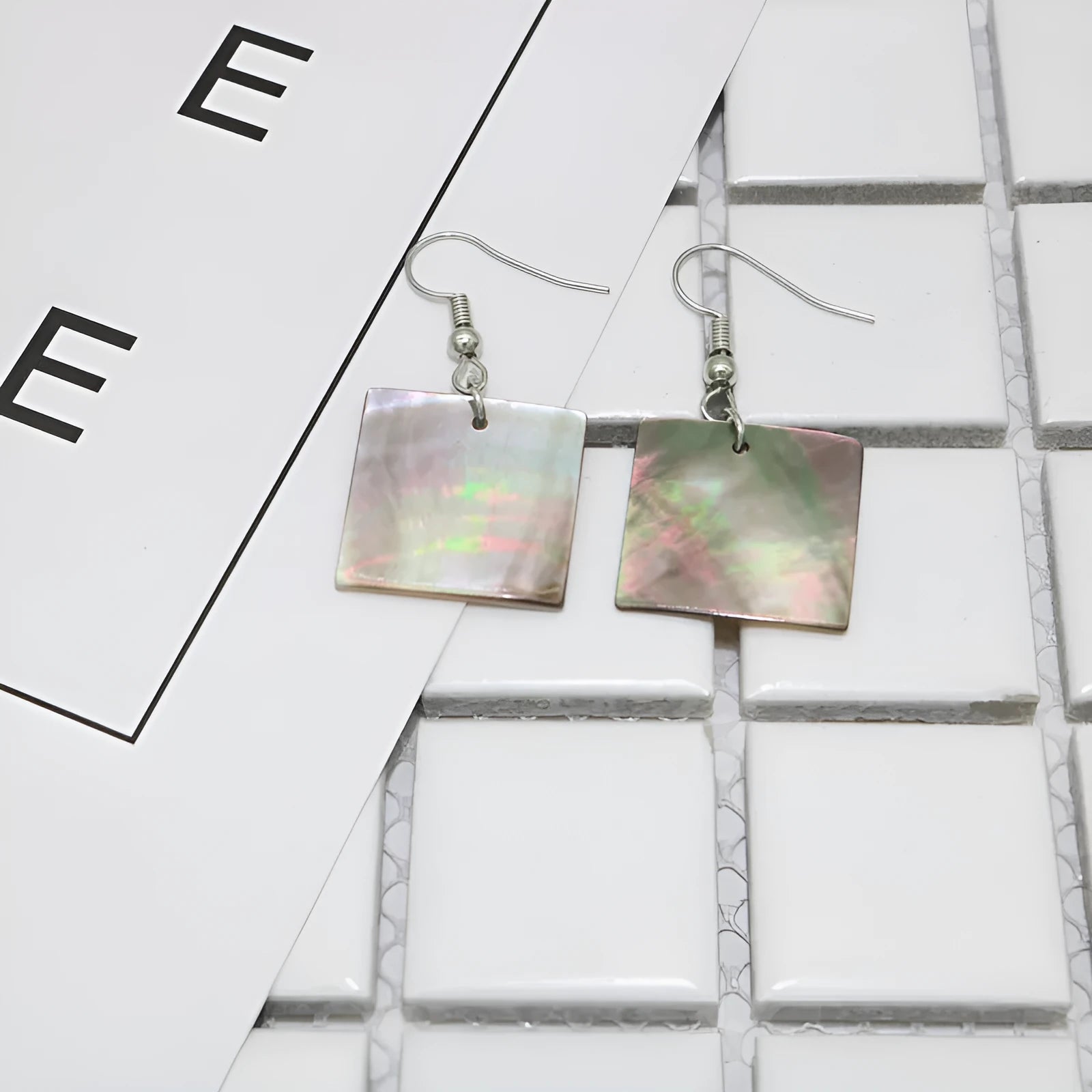 Geometric shell earrings in square and rectangular shapes with sterling silver hooks