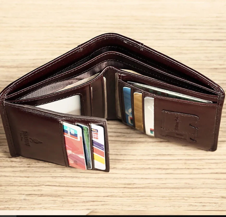 Men's leather organiser wallet open to show internal compartments including card slots and a zipped coin pocket.