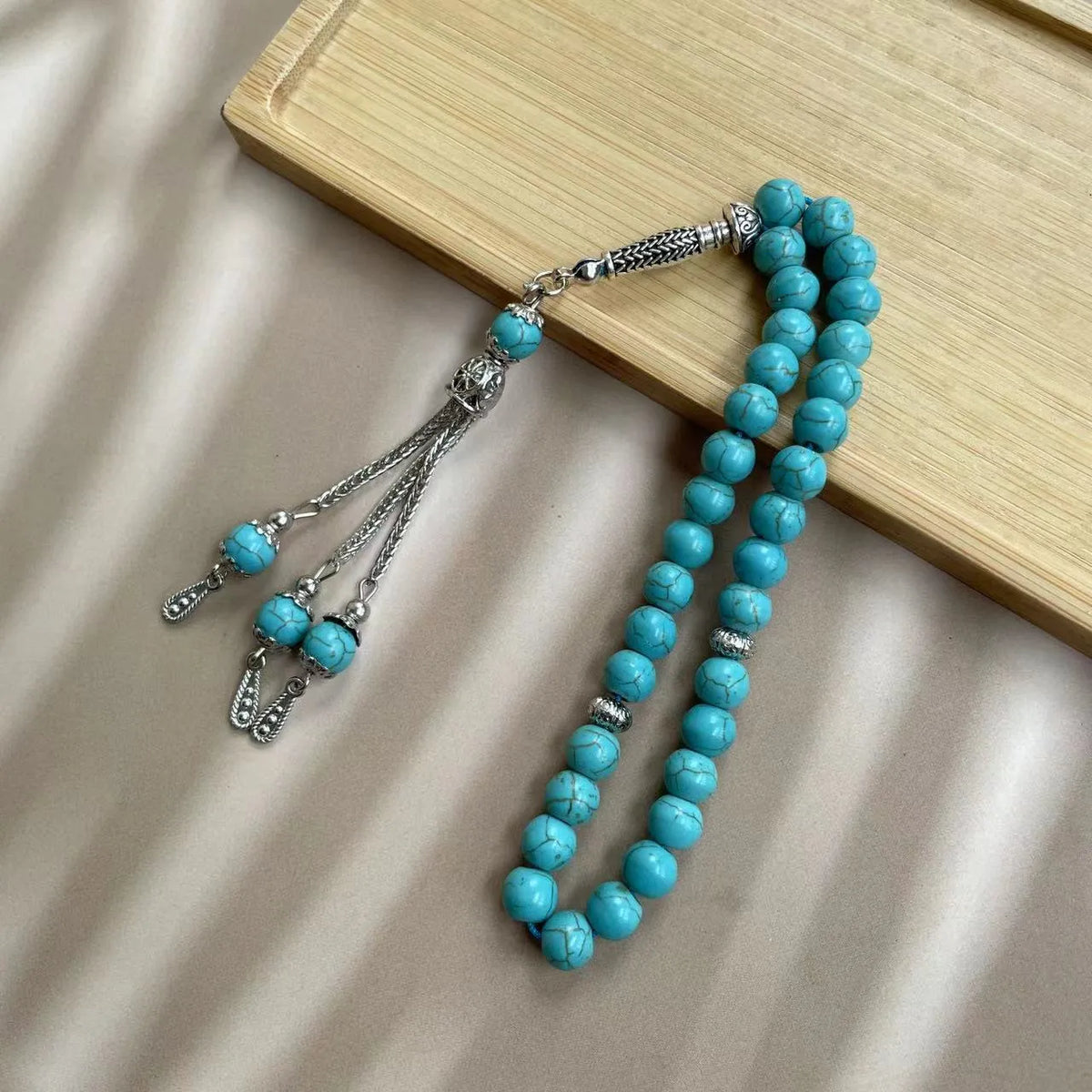 Sky blue stone bead Muslim prayer bracelet with adjustable knot on wrist