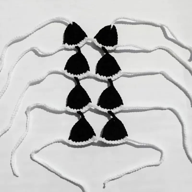 Colourful bikini costume for a cat or small dog on a white background.