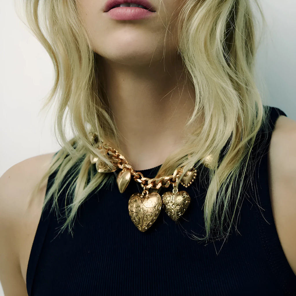 Carved heart pendant necklace in gold colour with adjustable chain length