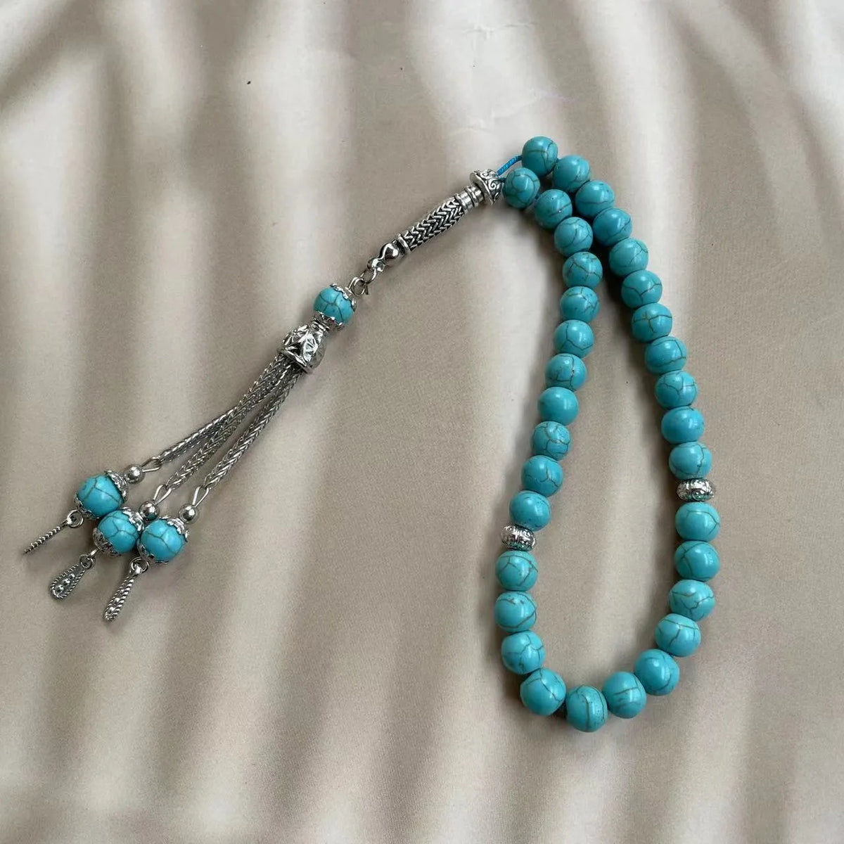 Sky blue stone bead Muslim prayer bracelet with adjustable knot on wrist