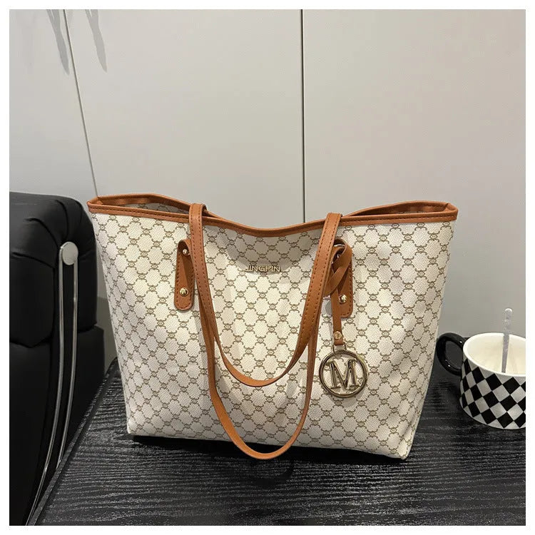 Western style shoulder bag in PU leather with sewing thread detail showing black colour option
