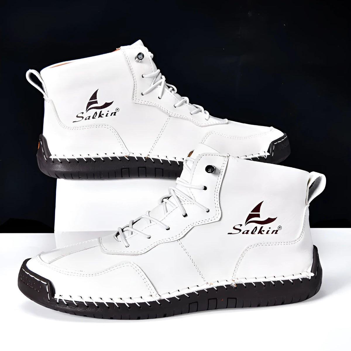 Men's dark blue retro high-top casual boots with lace-up front and elastic band on a white background.