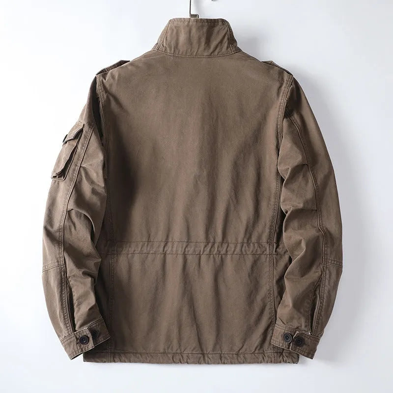Men's loose fit cotton twill jacket in light army green with zip front, shown on a model.