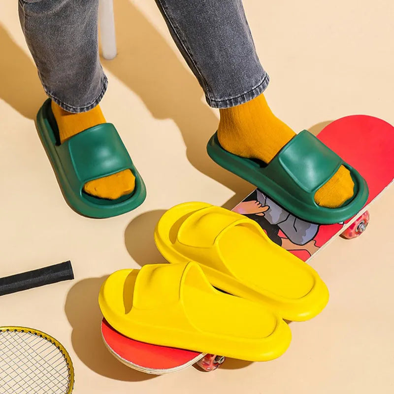 Thickened EVA non-slip flip-flop slippers in multiple colours on a bathroom floor.