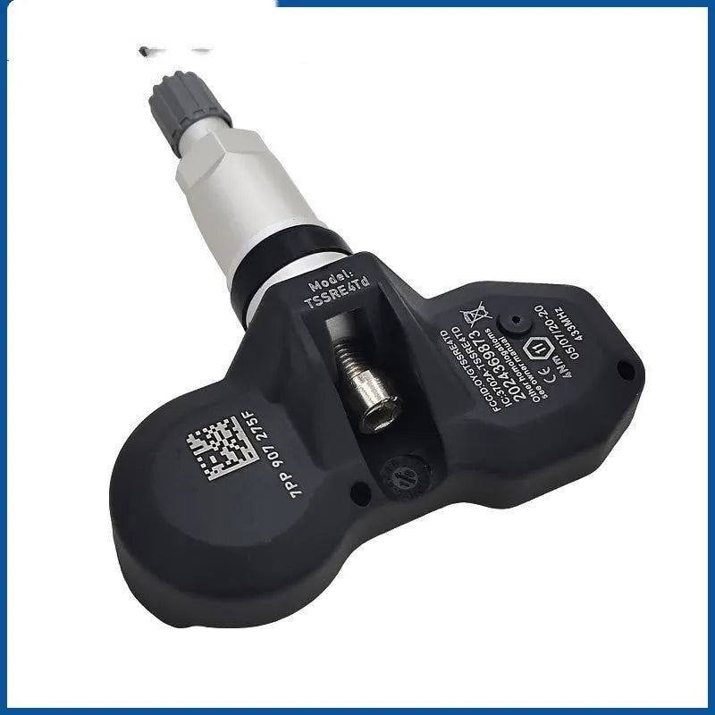 Audi car tyre pressure monitoring sensor with black housing shown alongside packaging