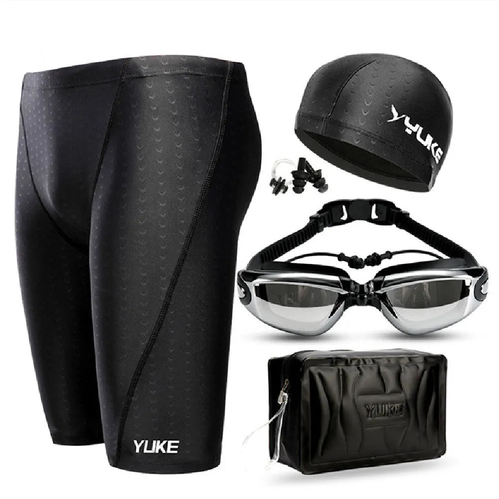 Men's black swimming set with briefs trunks, anti-fog goggles, waterproof cap, ear plugs, nose clip, and carry bag.