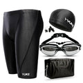Men's black swimming set with briefs trunks, anti-fog goggles, waterproof cap, ear plugs, nose clip, and carry bag.
