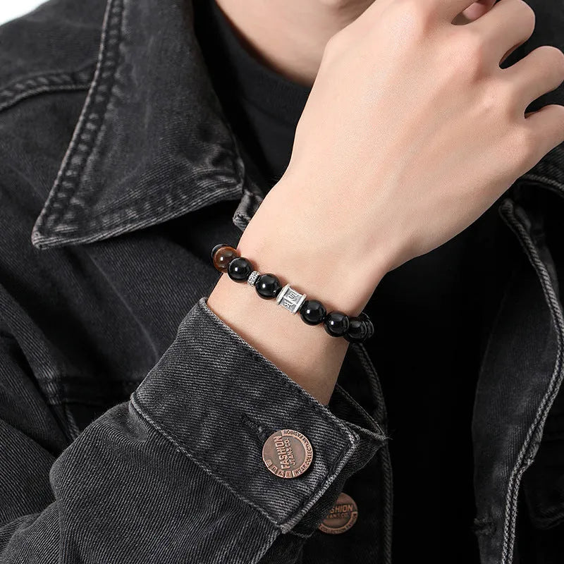 Men's obsidian bracelet with prayer wheel centrepiece and 10mm beads