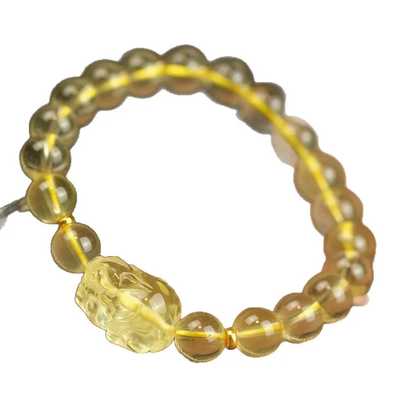 Yellow leather cord bracelet with a citrine artificial crystal Pi Xiu charm pendant