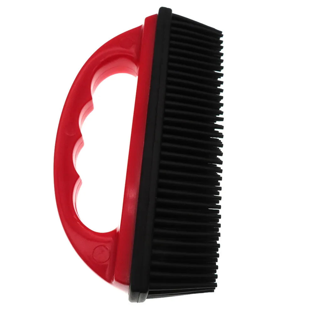 Red pet hair removal brush with silicone bristles and ergonomic handle on a white background.