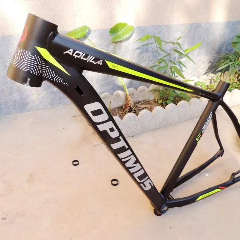 Black green aluminium 29-inch mountain bike frame with disc brake mounts and internal cable routing ports.
