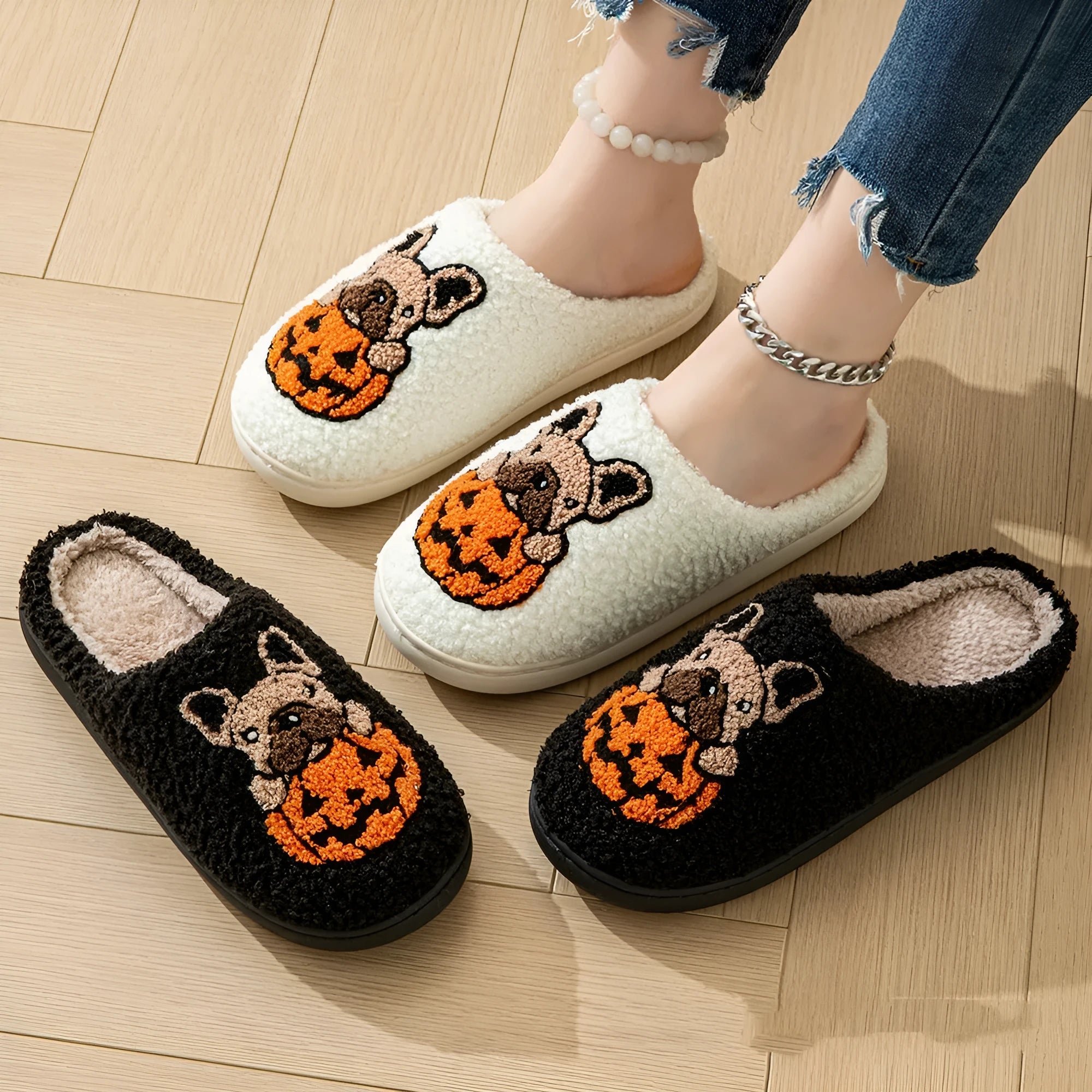Black and white Halloween pumpkin patterned plush slippers with round toe and TPR rubber soles