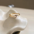 Golden stainless steel ring with love heart and oval designs showing electroplated finish and simple bracelet style