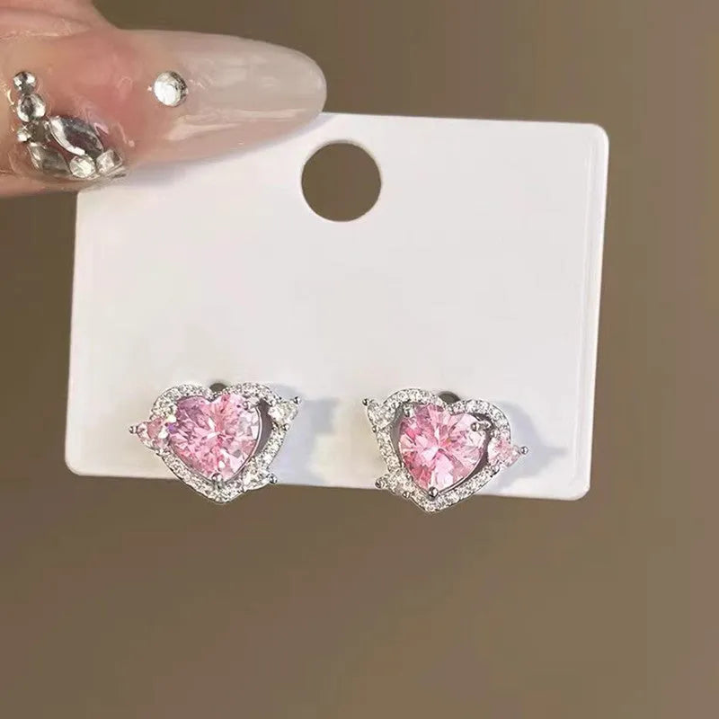 Heart shaped stud earrings with white k finish and copper construction for women