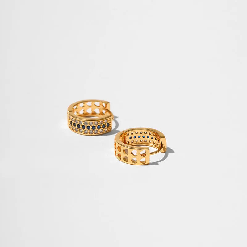 Round geometric women's earrings with copper construction and 18K gold electroplated finish.