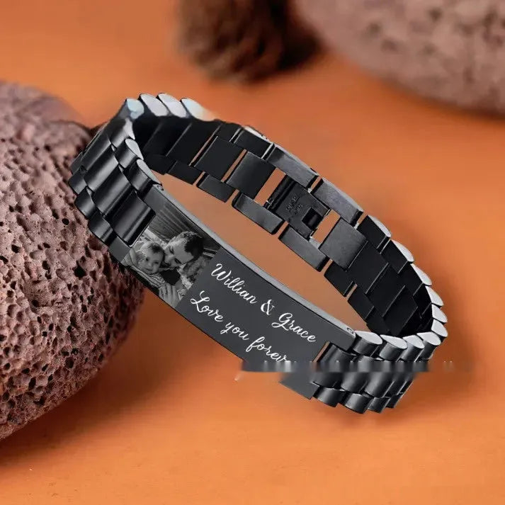 Titanium steel men's bracelet with curved heart shape and engraved lettering in black or grey finishes