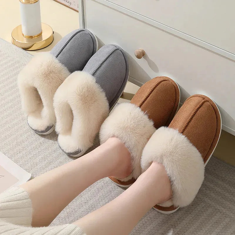 Women's plush-lined indoor slippers with round toe and flat heel in a choice of colours.
