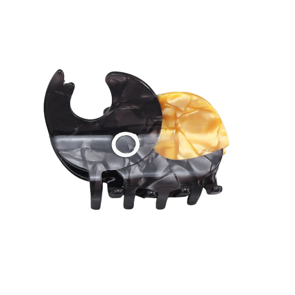 Handmade cellulose acetate beetle grip hair accessory with insect biology design