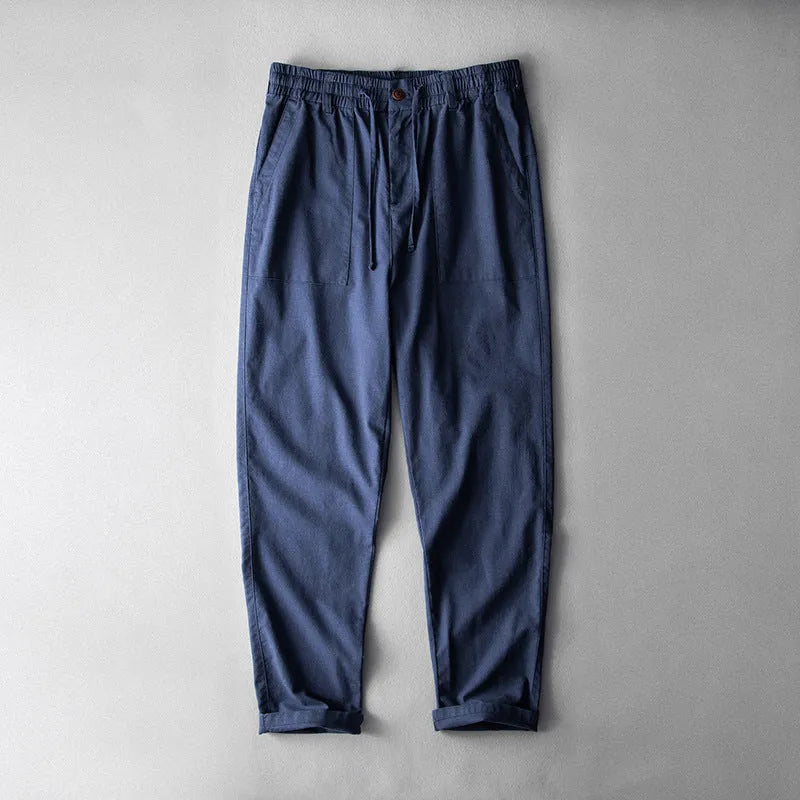 Men's casual linen trousers in retro design showing navy blue, apricot, and grey colour options
