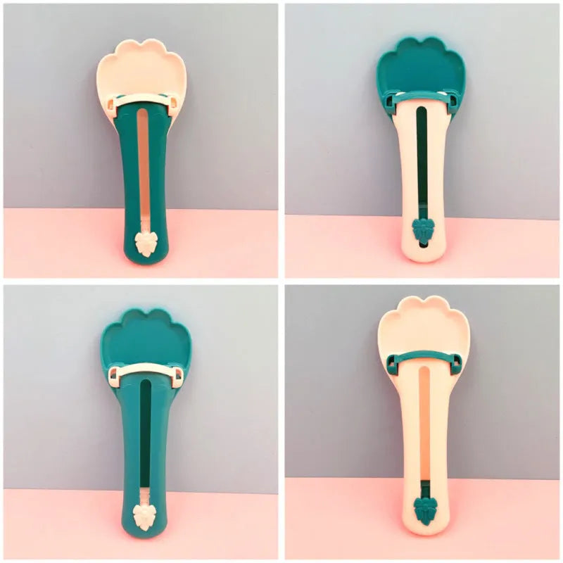 Green and pink pet feeding spoon with extrusion design for liquid food and snack dispensing