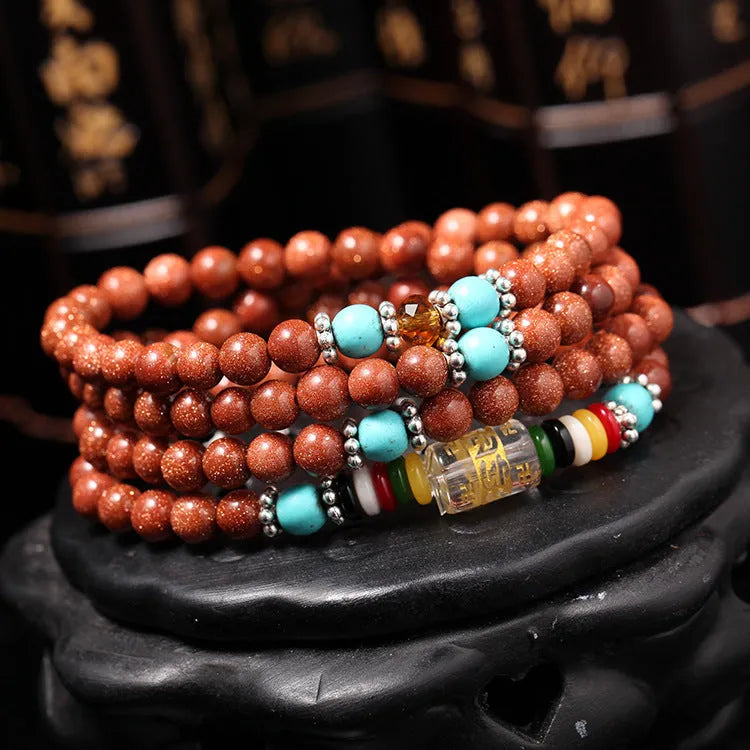 Women's multi-circle bracelet with 108 nugget sand beads, golden star stone accents, and retro fu character charms